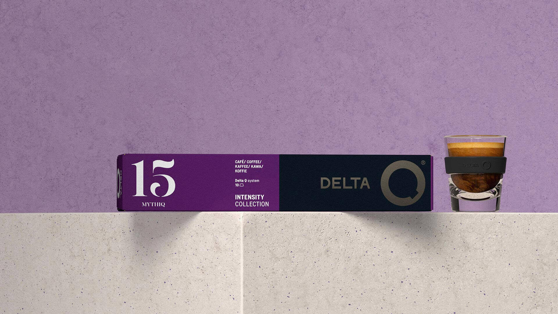 Delta Q capsule box and espresso on a lilac set
