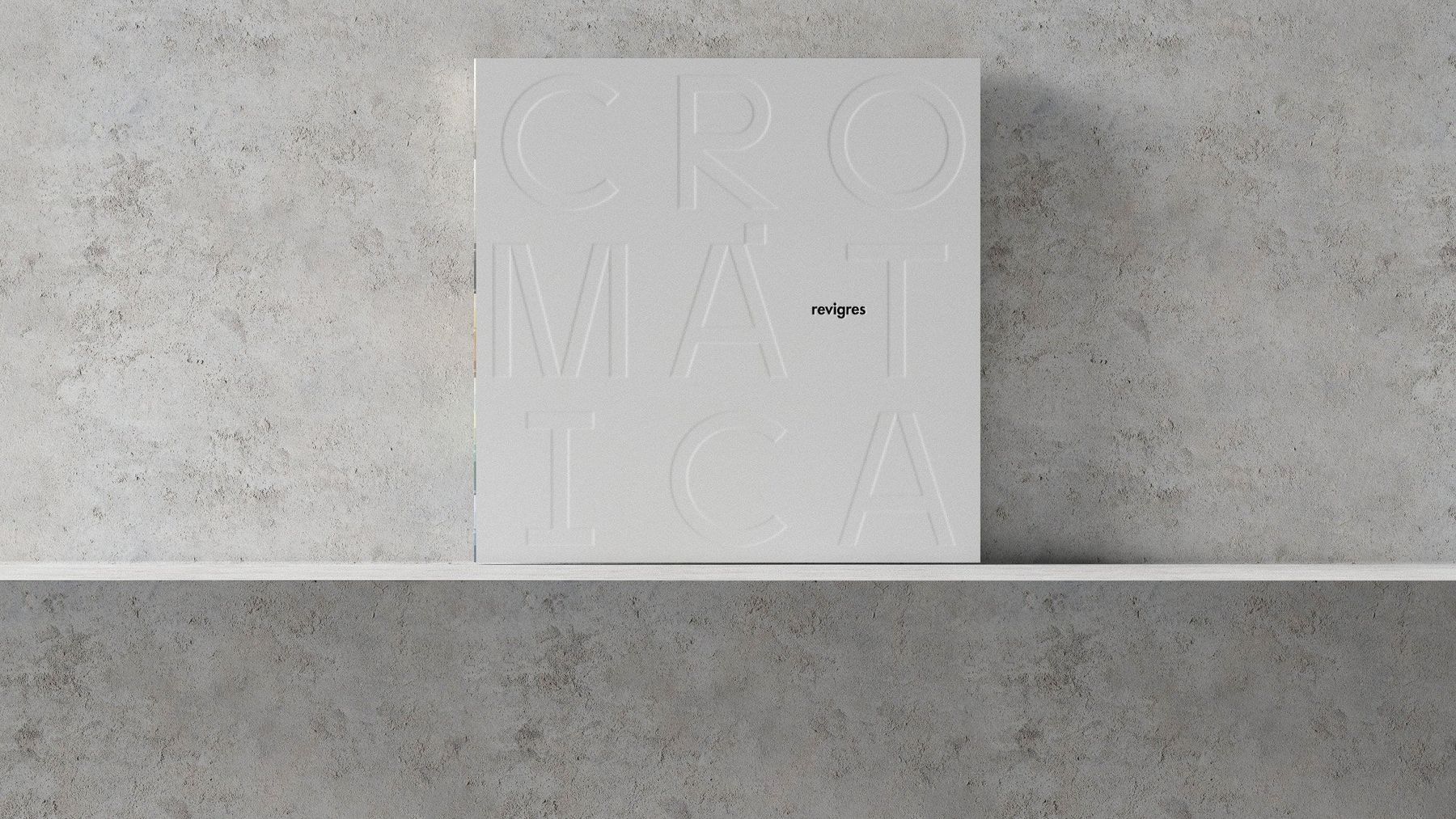 Cromática book cover with embossed lettering on a concrete shelf