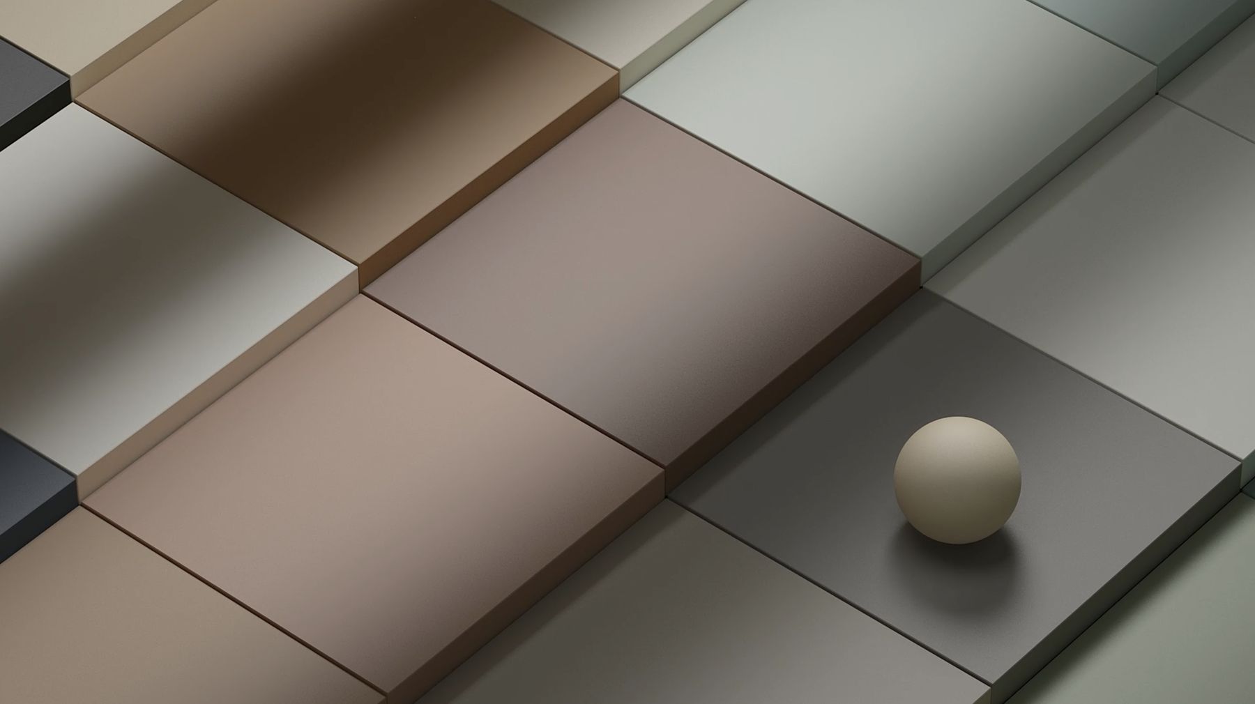 Close-up of Cromática tiles with a ceramic sphere